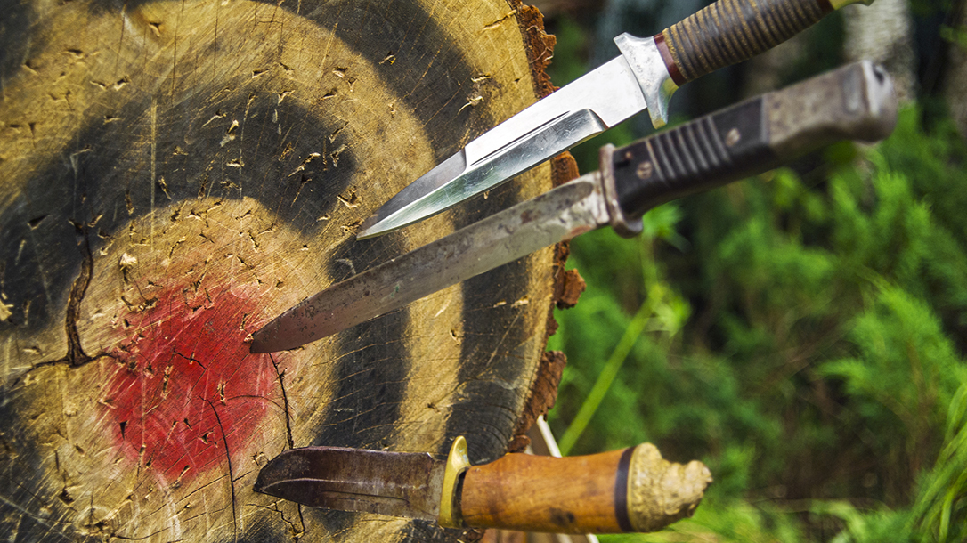 When throwing a non-traditional throwing knife, like this hunting knife, first determine if it’s handle heavy or blade heavy.