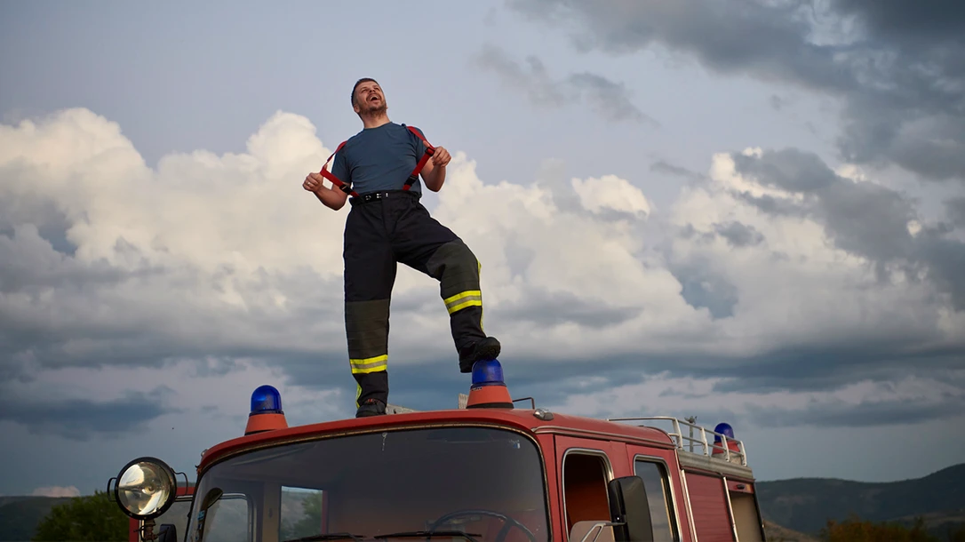 The firefighter's role extends beyond extinguishing fires; they also provide crucial medical assistance during emergencies and accidents.