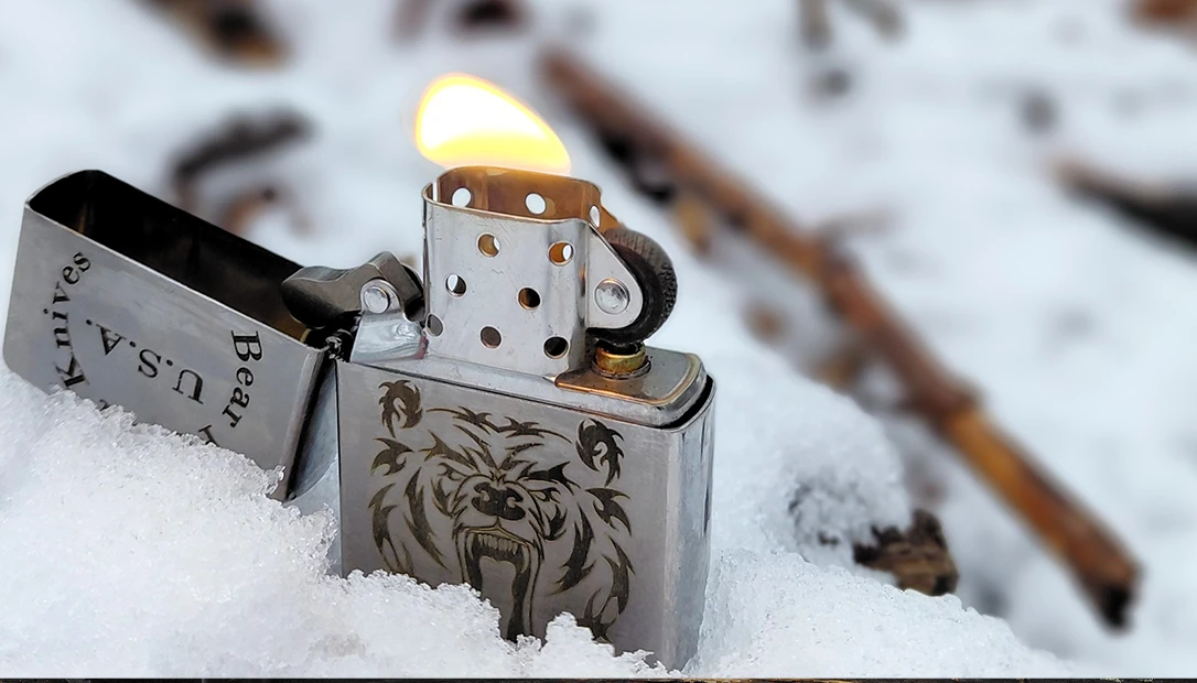 A classic Zippo lighter pictured here in the snow.
