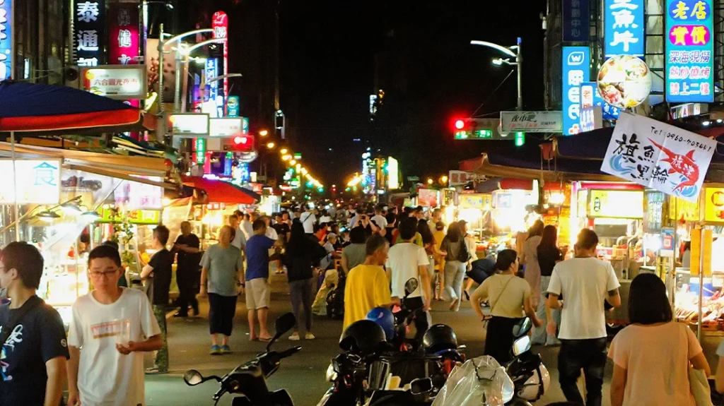 The night market buzzes with energy as vendors showcase an array of tantalizing street foods.