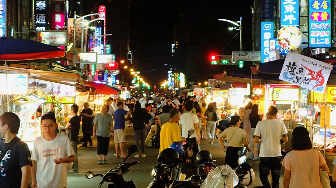The night market buzzes with energy as vendors showcase an array of tantalizing street foods.