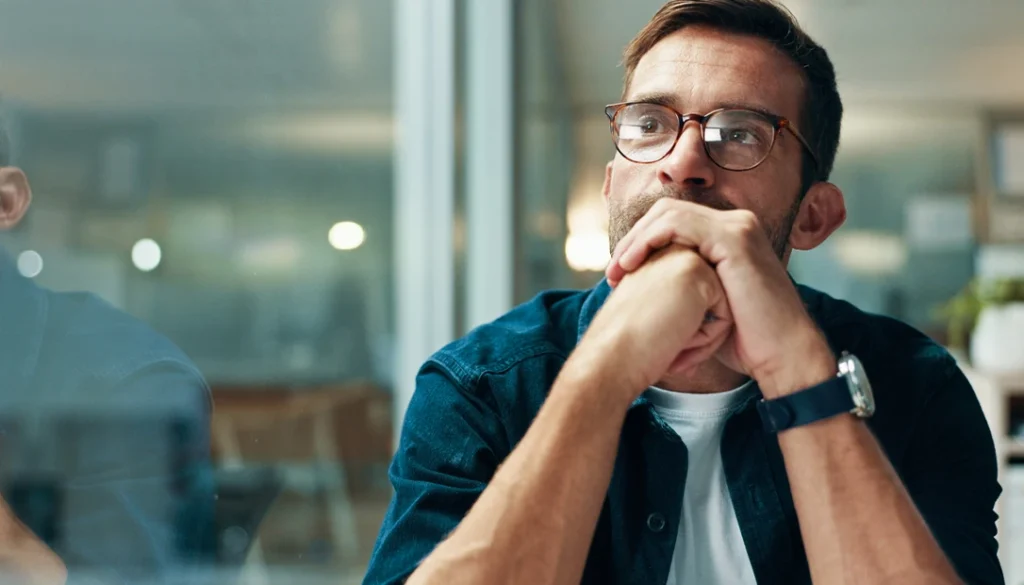 A solitary figure gazes at a wall of closed books, symbolizing the end of questioning in the age of certainty.