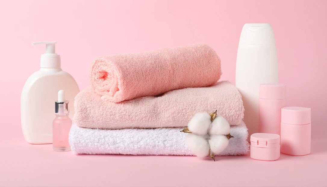 Stack of folded pink towels and gear used as a theft-prevention tactic for private military contractors working in group housing.